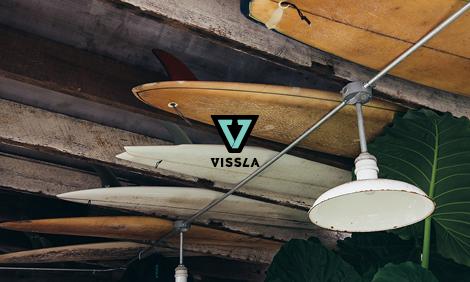 Vissla gift card with logo on top of a vintage image of surfboards